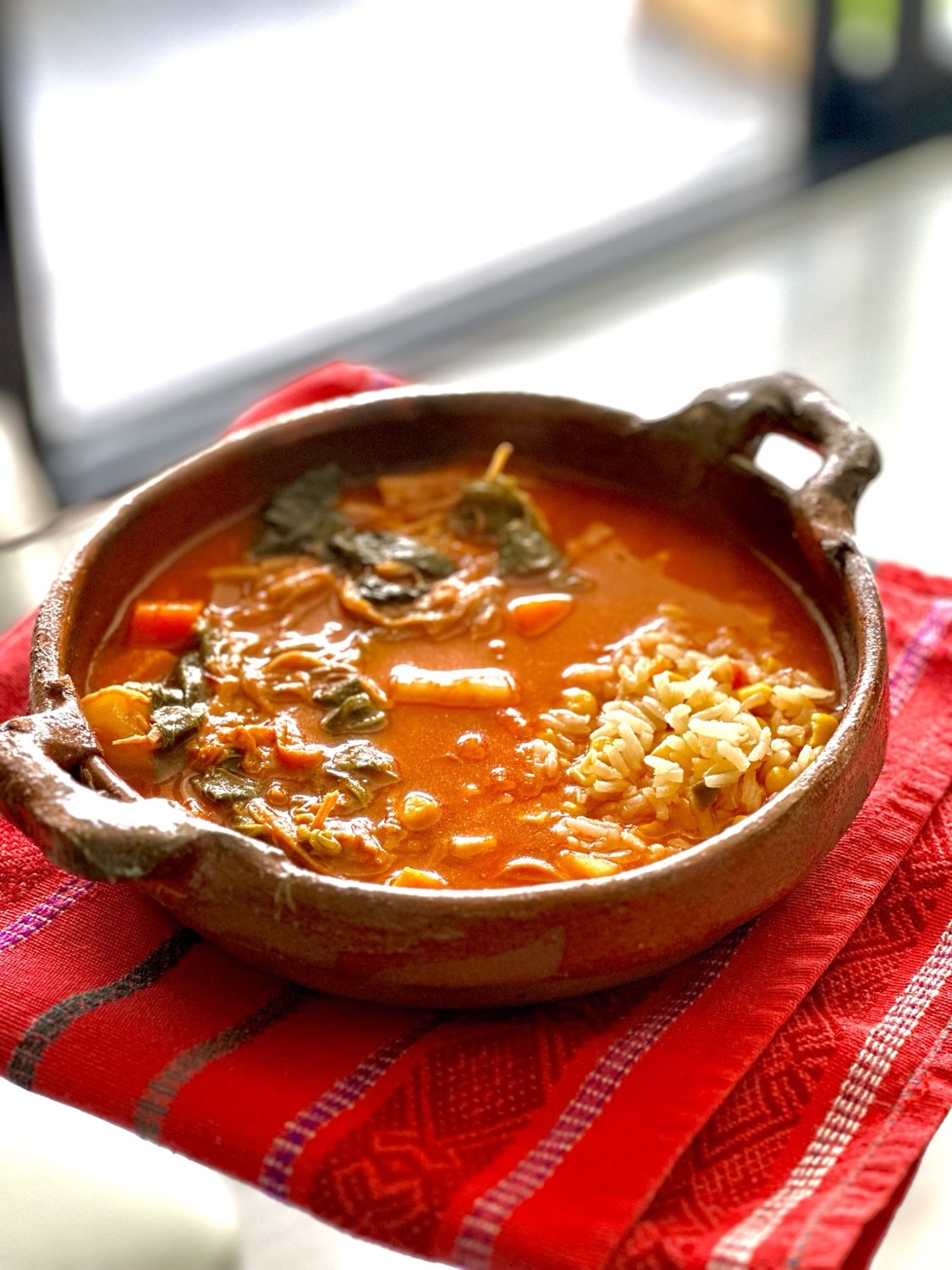 Traditional Guatemalan stew in a clay bowl